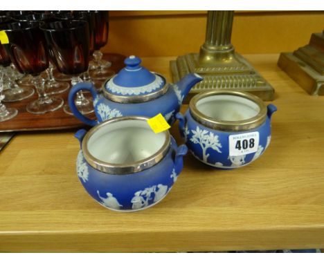 A blue Wedgwood Jasperware three-piece tea service each item with silver rim Condition report: The teapot and the bowl with t