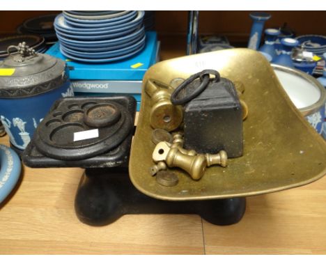 A set of old brass and iron scales with weights