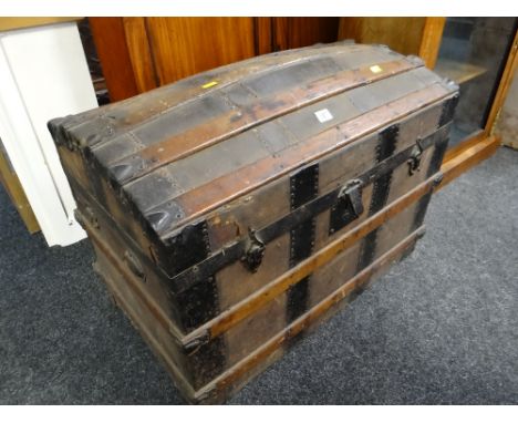 A late nineteenth century dome top cabin trunk