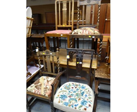 A pair of barley-twist and rosette carved vintage chairs and another together with a delicate mahogany elbow chair with tapes