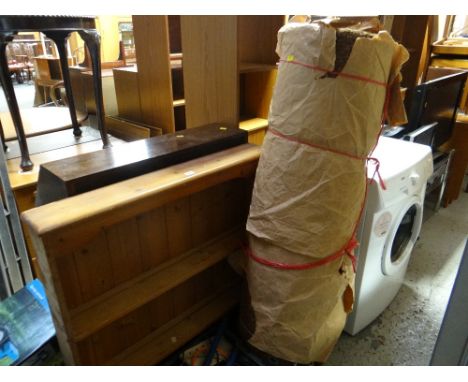 A vintage wooden stepladder, a Hessian roll of carpet and a pine rack