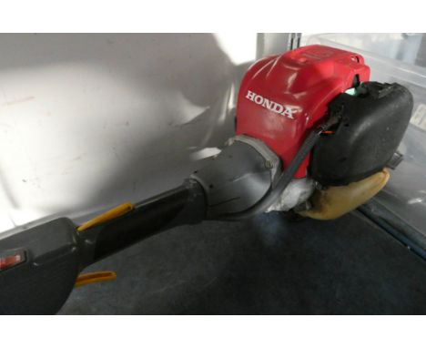 A Honda four stroke brush cutter, petrol engine, in full working order 