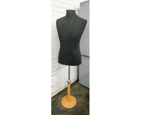 A top half mannequin on wood and chrome base 