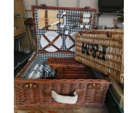 A wicker picnic hamper and a wicker Fortnum and Masons smaller hamper