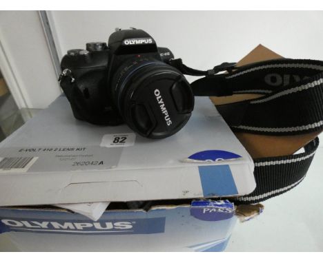 An Olympus digital camera with lenses etc 