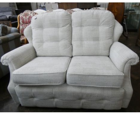 A GPlan two seater sofa in a pale green chenille fabric  Had very little use