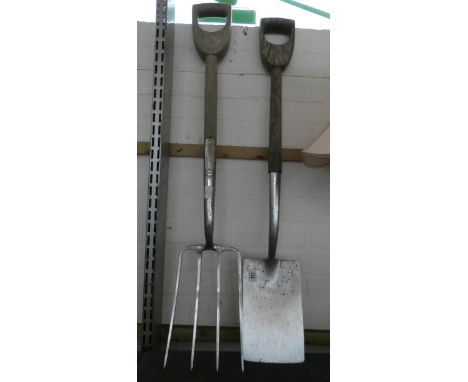 An old wooden handled stainless steel, spade and fork 