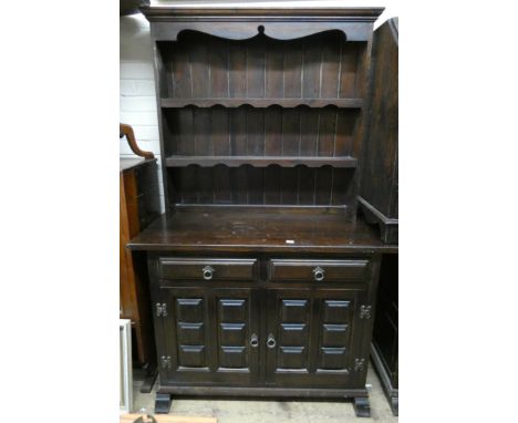 A dark stained kitchen dresser with shelf back, 3'9 wide