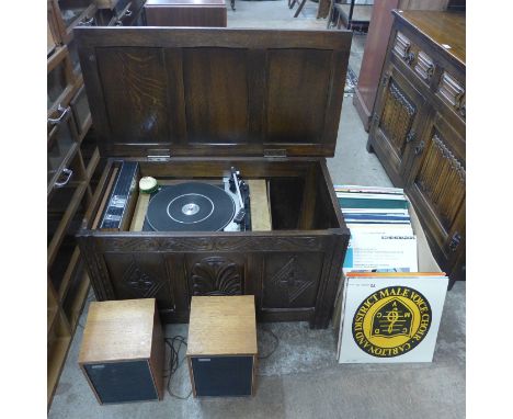 An oak cased Philips turntable, with amplifier and speakers 