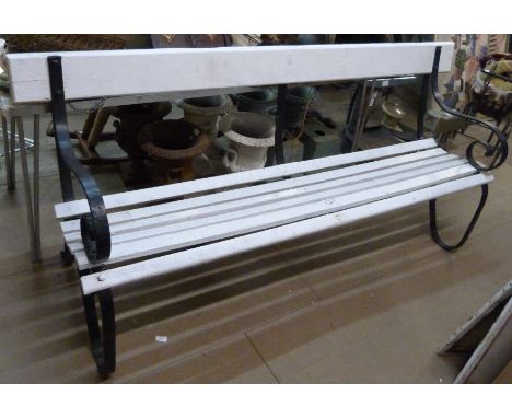 A wrought iron ended garden bench 