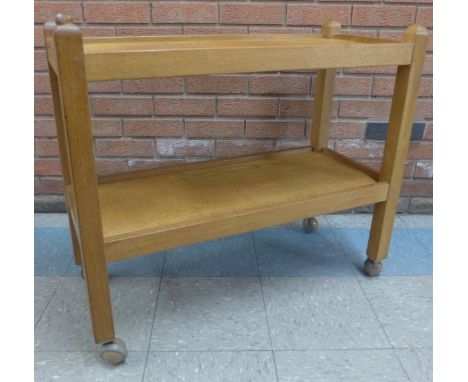Workshop of Robert "Mouseman" Thompson, a carved oak two tier trolley
