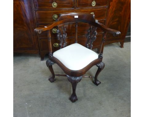 A Chippendale style carved mahogany corner chair 