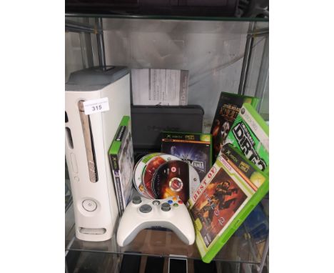 Xbox 360 console with power supply and games. 