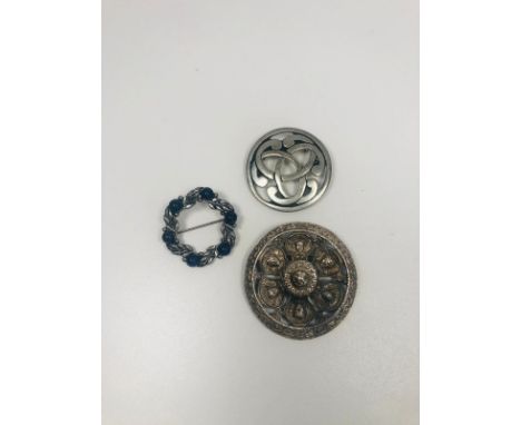 3 vintage brooches including a signed Celtic, St Justine vintage pewter brooch. 