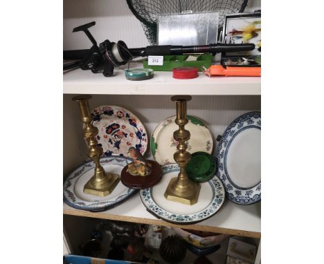 Shelf of collectables includes victorian draining bowls. 