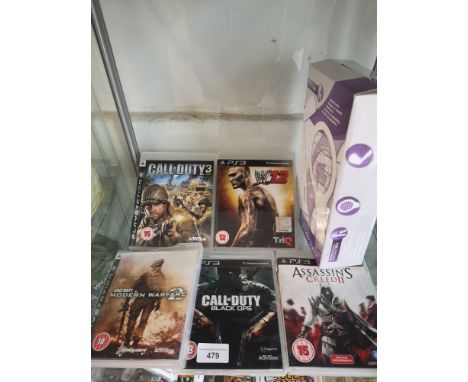 Shelf of PlayStation 3 games etc. 