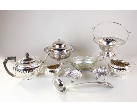 A silver plated muffin dish, a three piece silver plated tea set, a cake basket, a bonbon dish and a ladle and a pair of plat