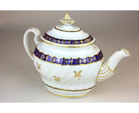 A Caughley porcelain teapot with gilt and blue border and thistle decoration on scalloped reeded body