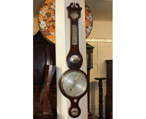 A George III mahogany banjo barometer marked C Pedretti, Birmingham, with subsidiary thermometer, spirit level and hygrometer