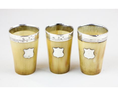 A set of three Victorian silver mounted horn 'tot' hunting tumblers with vacant shields and glass bases, maker FP, London 187