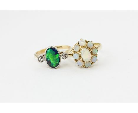 A black opal doublet and diamond ring; and an opal cluster ring