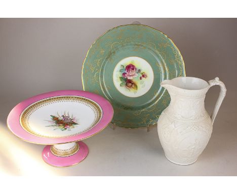 A Royal Worcester porcelain cabinet plate with central rose motif signed M Hunt with large green and gilt border 27.5cm diame