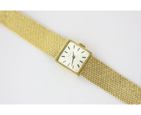 A ladies 18ct gold Tissot bracelet watch