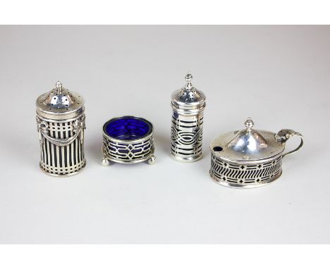 A Victorian  silver pepper with pierced detail, swag overlay and blue glass liner, maker William Hutton & Sons Ltd, London 18