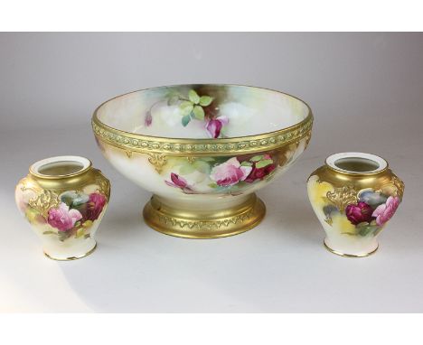 An early 20th century Royal Worcester blue ivory fruit bowl decorated with pink roses with overlaid gilt border, signed W E J