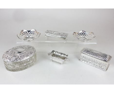 An Edward VII silver trough shaped trinket box, a pair of Edwardian silver bonbon dishes, a Victorian silver dressing table b