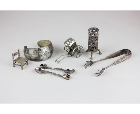 A Chinese silver rickshaw, maker Kwan Wo, a pair of sterling silver tongs, a Chinese silver vesta holder depicting a dragon, 