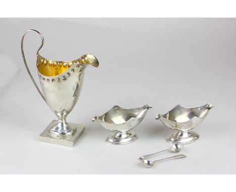 An Edward VII silver helmet shaped cream jug, maker Thomas Hayes, Birmingham 1905, together with a pair of silver salts, make