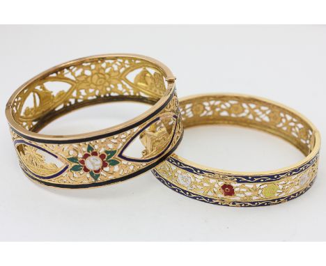 A Middle Eastern gold and enamel hinged bangle; and another smaller, 45g gross