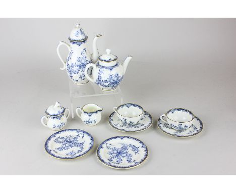 A Royal Worcester porcelain blue and white miniature tea set for two, with coffee pot, teapot, sugar bowl, milk jug and two t