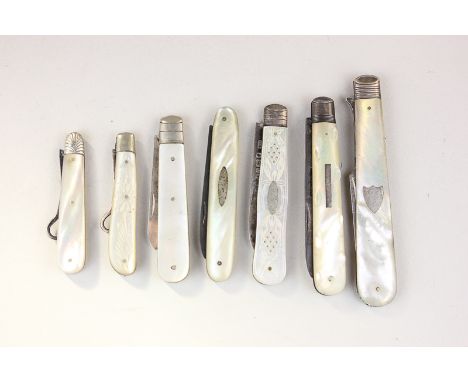 Three Victorian silver and mother of pearl penknives, one George V penknife, two 'penknife' button hooks and a folding Victor