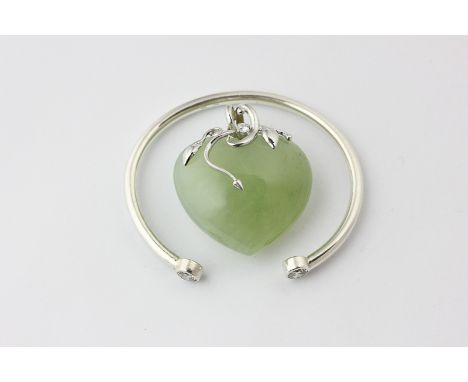 A silver mounted and gem set jade heart pendant and a silver and gem set bangle