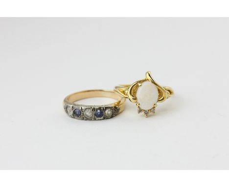 An opal and diamond ring in 18ct gold; and a sapphire five stone ring 