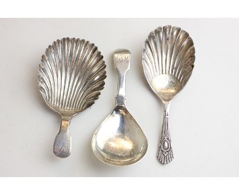 Three Victorian silver caddy spoons, two with shell bowls and two monogrammed