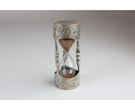 A Victorian silver cased glass egg timer with embossed floral decoration, Birmingham 1876, 8cm