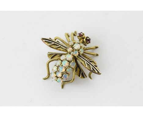 An opal set bee brooch with ruby eyes