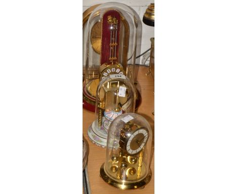 The Carousel Anniversary clock, under dome;   a  gilt clock, by Schalz;  a gilt Rhythm Quartz mantel clock;  etc (4)