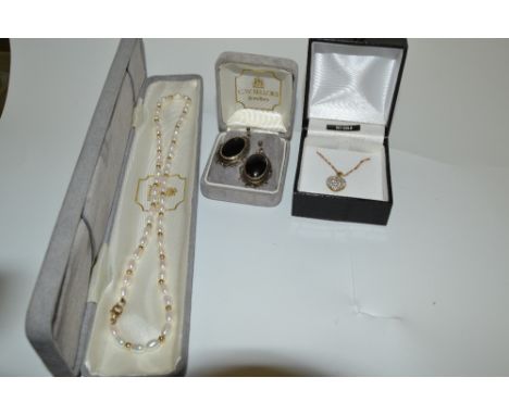 A seed pearl necklace'  a 9ct gold heart pendant;  a pair of onyx earrings (3)