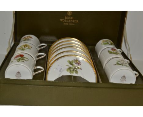A Royal Worcester Individual Flowers pattern coffee set for six, each cup and saucer painted and printed with a single flower