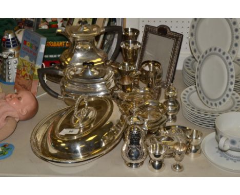 Plated Ware- a four piece E.P.N.S tea service;  an oval entree dish;  an easel photograph frame;  a three piece condiment set