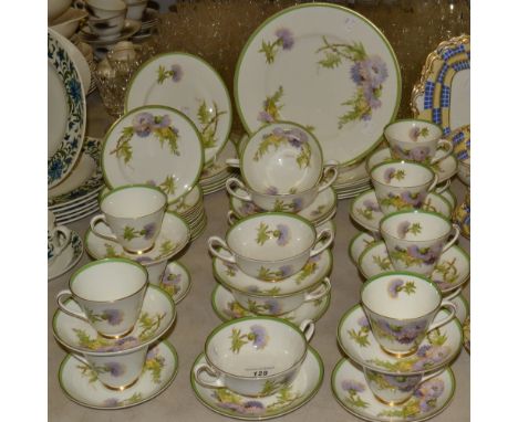 A Royal Doulton Glamis Thistle dinner and tea service inc 12 cups and saucers, six soup bowls, five saucers; dinner and desse