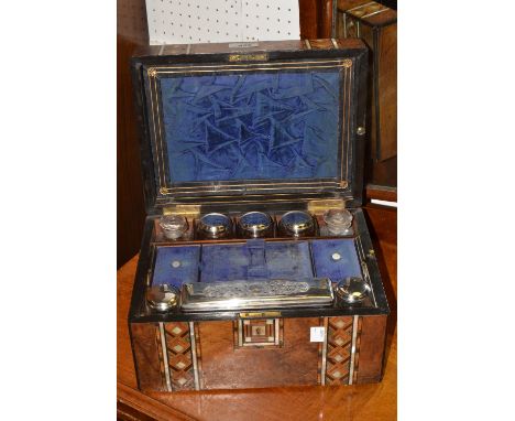 A late Victorian walnut dressing table box, with two broad bands in Tunbridge Ware and mother-of-pearl, the interior fitted w
