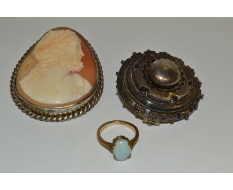 A Victorian silver target brooch;  a silver mounted cameo;  an opal ring, 9ct gold shank (3)