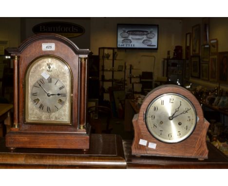 An Edwardian mahogany mantel clock,the arched silver faced engraved with foliate scrolls, Roman numerals, subsidiary Silent/C
