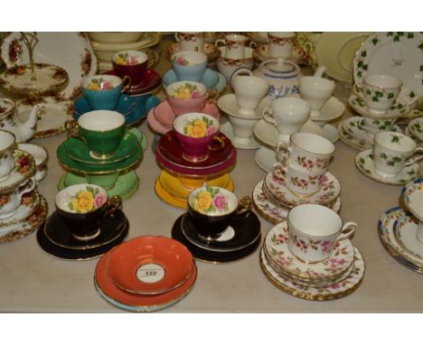 Teaware - an Edwardian China tea service, for fifteen, each piece with a red and yellow rose to interior, the exterior in var