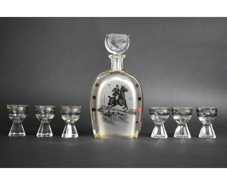 An Art Deco Continental Decanter and 6 Tot Glass Set, The Decanter of Horseshoe Shape and Engraved with Huntsman and Hounds. 